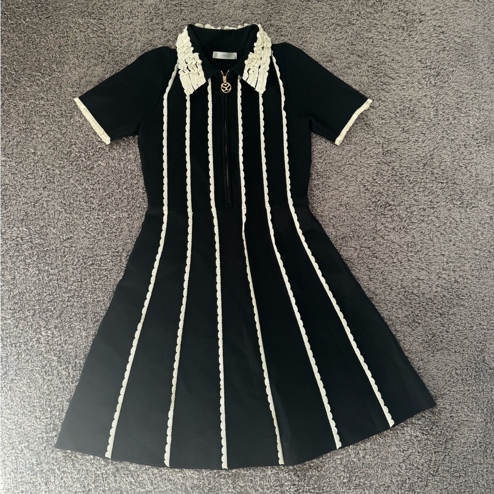 Chic Black Dress with White Trim